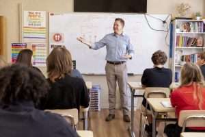 A teacher in front of the class